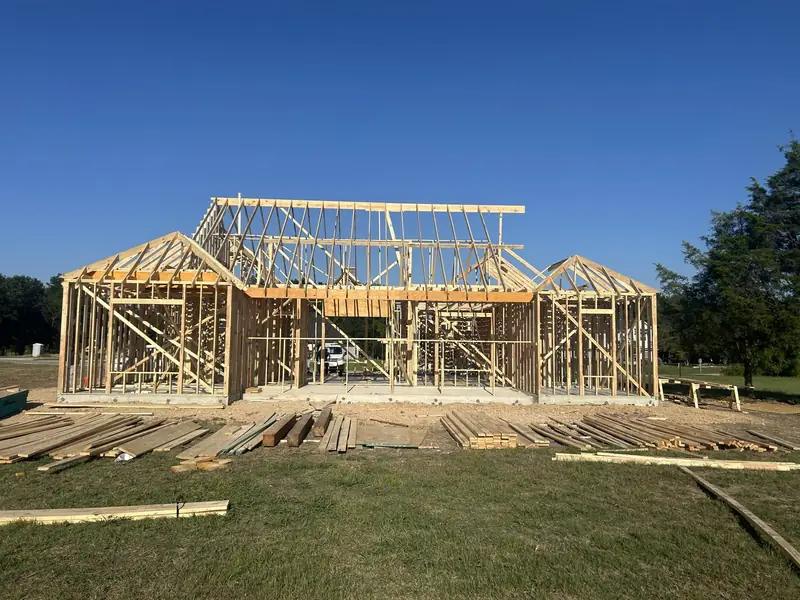 Front of the framed home with gables